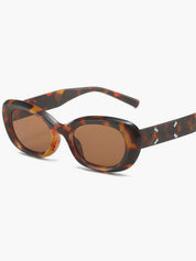 Tortoiseshell Zonnebril met Ovale Montuur en Metalen Accenten, Dames - Maelen
