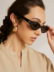 Smalle Ovale Dames Zonnebril met Zwart Minimalistisch Design en UV-bescherming - Maelen