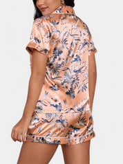 Allegra satijnen pyjamaset dames – luxe tropische print met bies