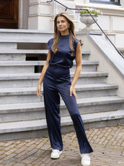 Giovanna dames jumpsuit – satijnlook met open rug & wijde pijpen