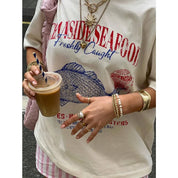 Alessandra T-Shirt | Oversized Graphic Tee met Artistieke Vissenprint voor Dames