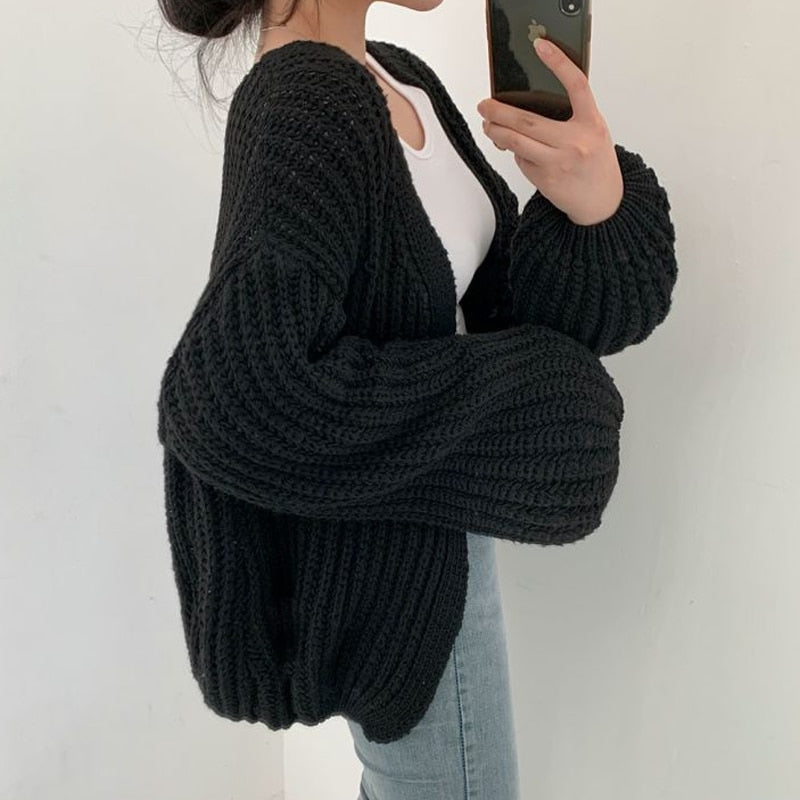Elena Oversized dames trui – chunky knit trui met ballonmouwen en open design