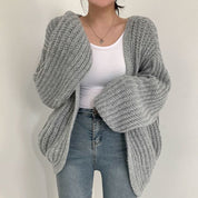Elena Oversized dames trui – chunky knit trui met ballonmouwen en open design