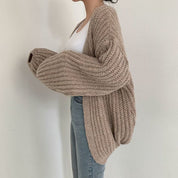 Elena Oversized dames trui – chunky knit trui met ballonmouwen en open design
