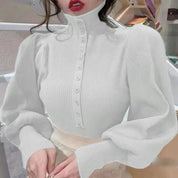 Valeria Coltrui | Elegante Coltrui met Pofmouwen en Subtiele Knoopsluiting